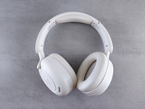 Modern White Wireless Headphones on Gray Surface